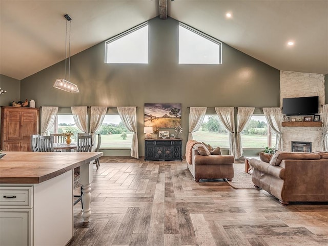 4920 W Forrest Hills Rd, Guthrie, OK 73044 - living room featuring a fireplace, high vaulted ceiling, and healthy amount of natural light