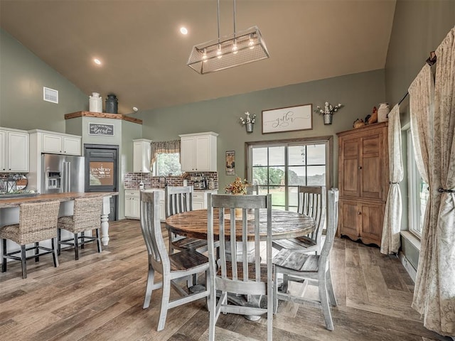 4920 W Forrest Hills Rd, Guthrie, OK 73044 - dining area featuring high vaulted ceiling and light wood-style floors
