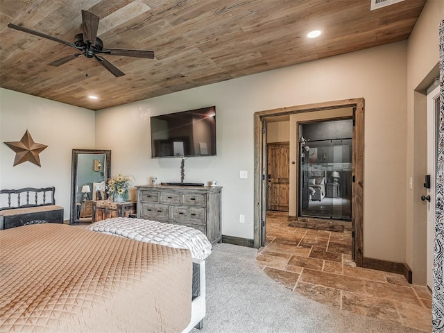 4920 W Forrest Hills Rd, Guthrie, OK 73044 - bedroom featuring wood ceiling, stone tile flooring, recessed lighting, and a ceiling fan