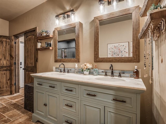 4920 W Forrest Hills Rd, Guthrie, OK 73044 - bathroom with stone tile floors and double vanity