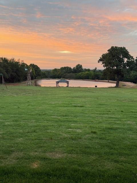 4920 W Forrest Hills Rd, Guthrie, OK 73044 - view of home's community featuring a lawn and a water view