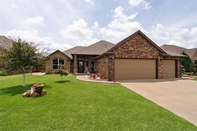 12816 NW 6th St, Yukon, OK 73099 - view of front of house featuring an attached garage, a front lawn, driveway, brick siding, and roof with shingles