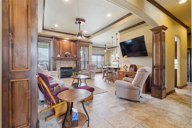 12816 NW 6th St, Yukon, OK 73099 - living room featuring ornamental molding, arched walkways, a ceiling fan, a fireplace, and recessed lighting