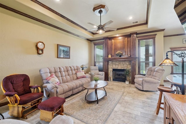 12816 NW 6th St, Yukon, OK 73099 - living room with crown molding, a raised ceiling, and healthy amount of natural light