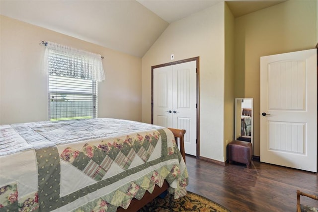 12816 NW 6th St, Yukon, OK 73099 - bedroom with wood finished floors, vaulted ceiling, and a closet