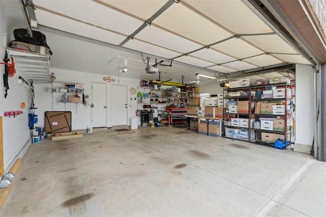 12816 NW 6th St, Yukon, OK 73099 - garage with a workshop area and a garage door opener