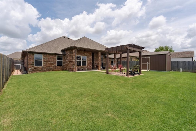 12816 NW 6th St, Yukon, OK 73099 - back of house with a pergola, a storage unit, a fenced backyard, roof with shingles, and a patio area