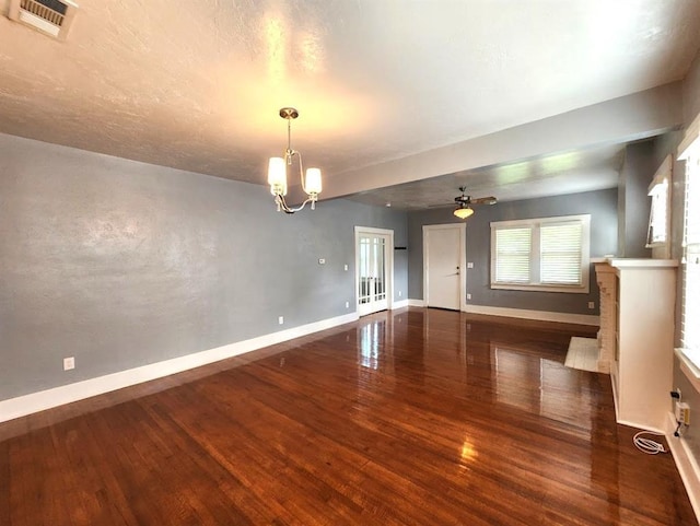 2719 NW 14th St, Oklahoma City, OK 73107 - empty room with wood finished floors, a chandelier, and ceiling fan