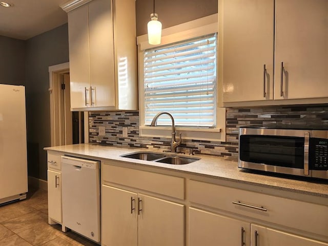 2719 NW 14th St, Oklahoma City, OK 73107 - kitchen featuring white appliances, backsplash, and light countertops
