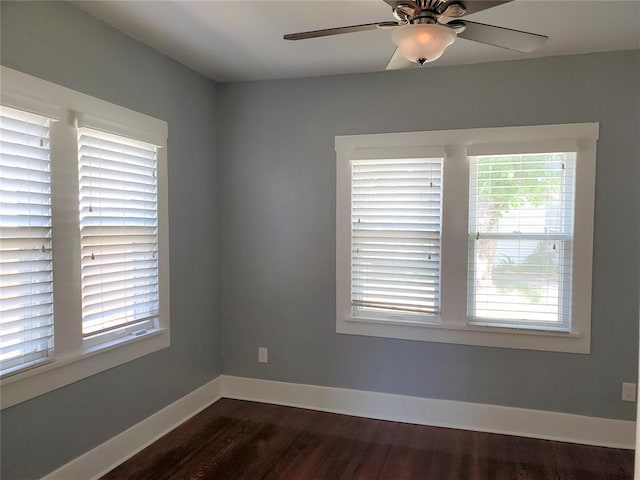 2719 NW 14th St, Oklahoma City, OK 73107 - spare room featuring plenty of natural light, dark wood-style flooring, and ceiling fan