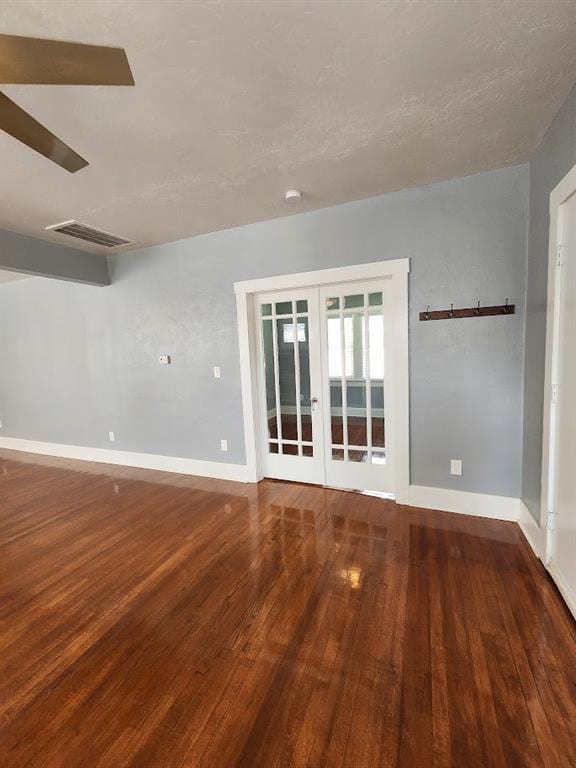2719 NW 14th St, Oklahoma City, OK 73107 - unfurnished room featuring french doors, wood finished floors, and a smoke detector