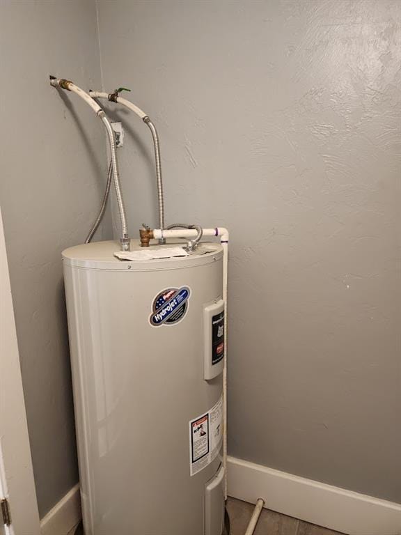 2719 NW 14th St, Oklahoma City, OK 73107 - utility room featuring electric water heater