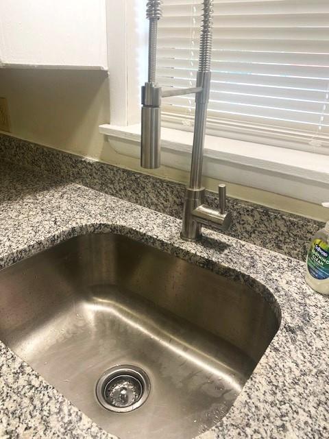 6101 S Douglas Ave, Oklahoma City, OK 73139 - kitchen view of a sink and stone counters