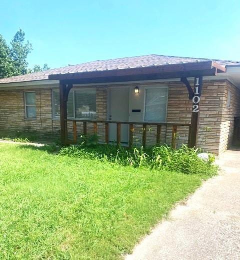 6101 S Douglas Ave, Oklahoma City, OK 73139 - rear view of property featuring driveway and roof with shingles