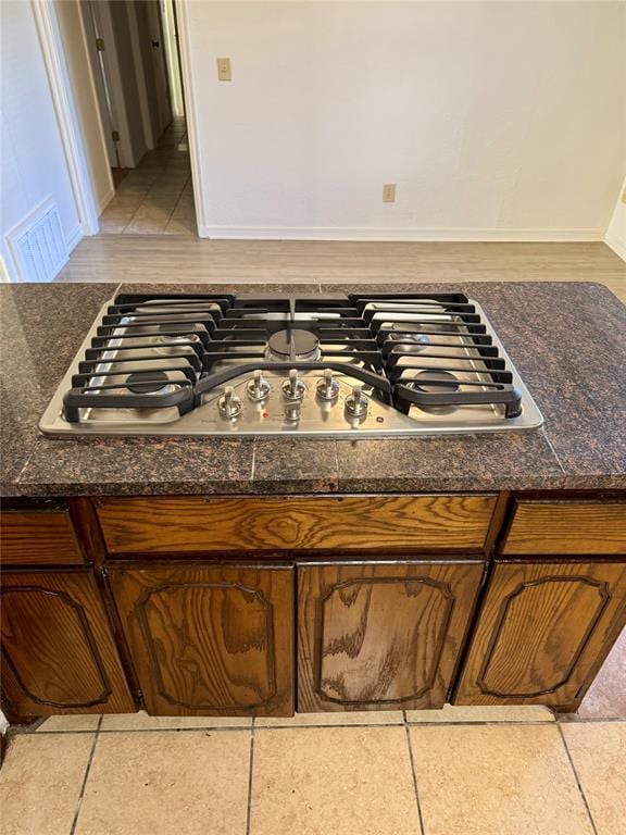 6101 S Douglas Ave, Oklahoma City, OK 73139 - kitchen view of stainless steel gas stovetop and dark stone countertops