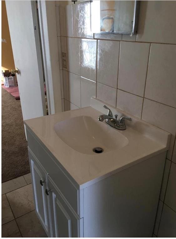 6101 S Douglas Ave, Oklahoma City, OK 73139 - bathroom featuring vanity and tile walls