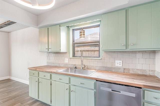 1004 Ranchoak Ct, Yukon, OK 73099 - kitchen with dishwasher, butcher block countertops, decorative backsplash, and light wood-type flooring
