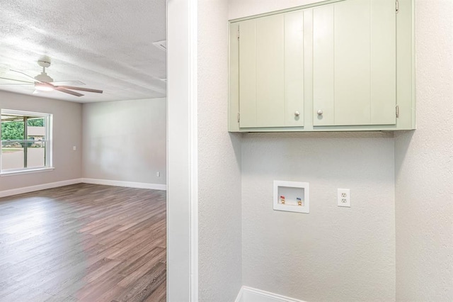 1004 Ranchoak Ct, Yukon, OK 73099 - laundry area with cabinet space, wood finished floors, hookup for a washing machine, a ceiling fan, and a textured ceiling