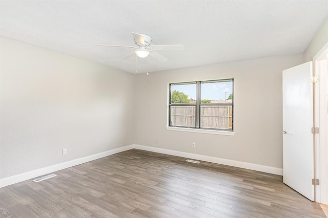 1004 Ranchoak Ct, Yukon, OK 73099 - spare room with a ceiling fan and wood finished floors
