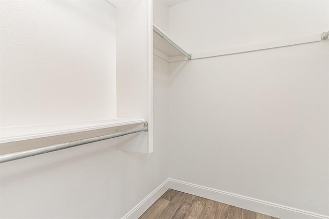 1004 Ranchoak Ct, Yukon, OK 73099 - spacious closet with light wood-style flooring