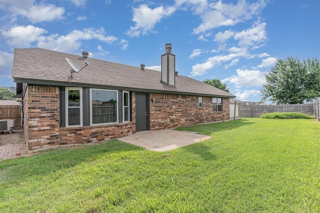 1004 Ranchoak Ct, Yukon, OK 73099 - rear view of property with brick siding, a patio, and a chimney
