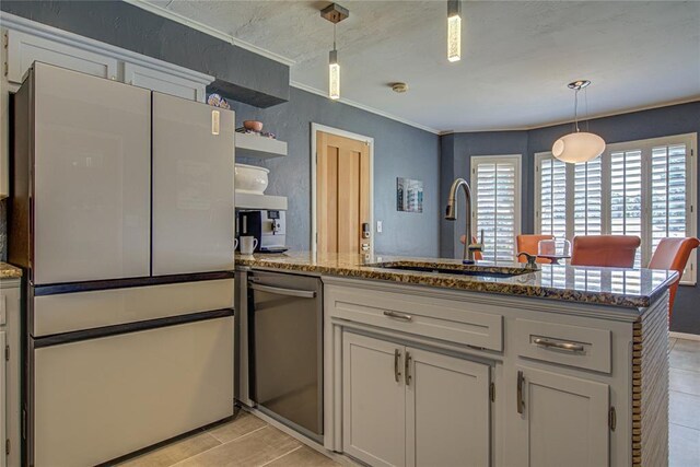 4973 NW 31st Ter, Oklahoma City, OK 73122 - kitchen with freestanding refrigerator, dishwasher, open shelves, a peninsula, and light stone counters