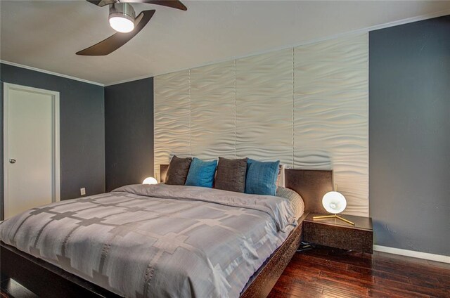 4973 NW 31st Ter, Oklahoma City, OK 73122 - bedroom featuring hardwood / wood-style floors, crown molding, and a ceiling fan