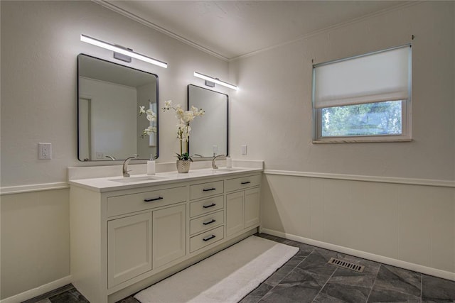 4973 NW 31st Ter, Oklahoma City, OK 73122 - full bath featuring double vanity, crown molding, and marble finish floors