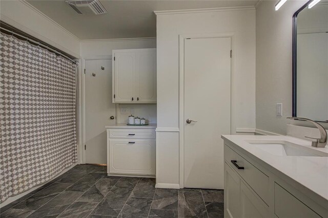 4973 NW 31st Ter, Oklahoma City, OK 73122 - bathroom featuring vanity, a shower with shower curtain, and ornamental molding
