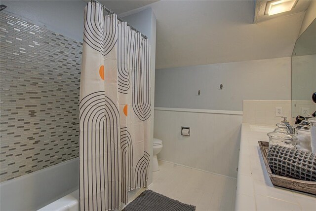 4973 NW 31st Ter, Oklahoma City, OK 73122 - full bath with wainscoting, shower / tub combo, vanity, and tile patterned floors
