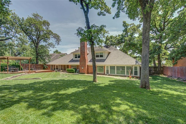 4973 NW 31st Ter, Oklahoma City, OK 73122 - back of property with a fenced backyard, a chimney, and a shingled roof
