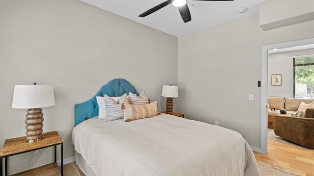 627 Couch Dr Unit S05, Oklahoma City, OK 73102 - bedroom with light wood-style floors and ceiling fan