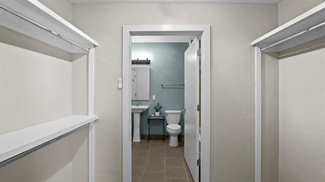 627 Couch Dr Unit S05, Oklahoma City, OK 73102 - walk in closet with tile patterned flooring