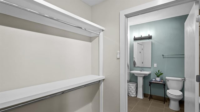 627 Couch Dr Unit S05, Oklahoma City, OK 73102 - bathroom featuring toilet and tile patterned floors