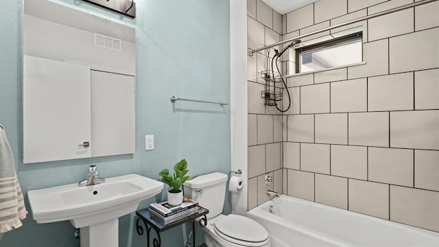 627 Couch Dr Unit S05, Oklahoma City, OK 73102 - bathroom featuring toilet and shower / tub combination
