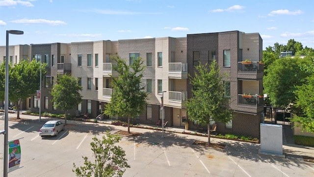 627 Couch Dr Unit S05, Oklahoma City, OK 73102 - view of building exterior with uncovered parking