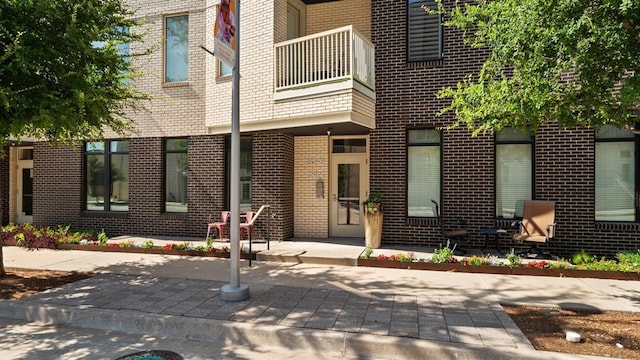 627 Couch Dr Unit S05, Oklahoma City, OK 73102 - property entrance featuring brick siding