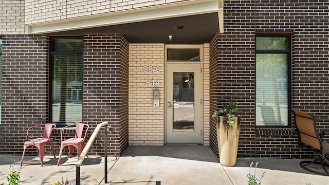 627 Couch Dr Unit S05, Oklahoma City, OK 73102 - property entrance with brick siding