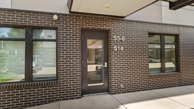627 Couch Dr Unit S05, Oklahoma City, OK 73102 - view of exterior entry with brick siding