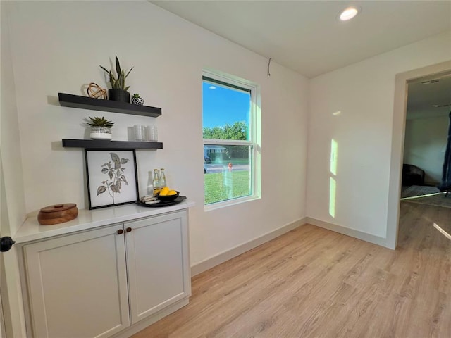 2332 NW 31st St, Oklahoma City, OK 73112 - unfurnished dining area with light wood-style floors and recessed lighting