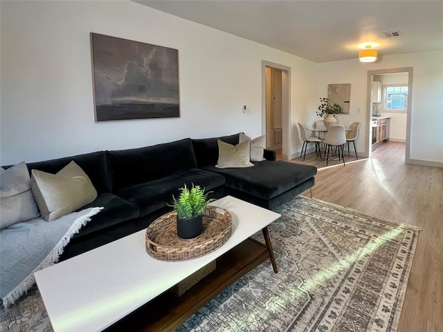 2332 NW 31st St, Oklahoma City, OK 73112 - living room featuring wood finished floors and baseboards
