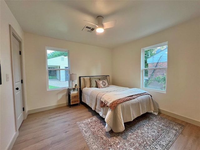 2332 NW 31st St, Oklahoma City, OK 73112 - bedroom featuring multiple windows, light wood-type flooring, and ceiling fan