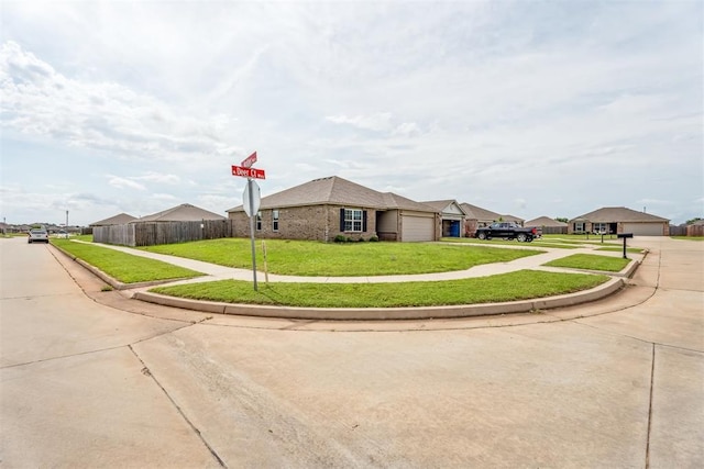 1016 N Deer Court Way, Mustang, OK 73064 - view of front of home with a garage and concrete driveway