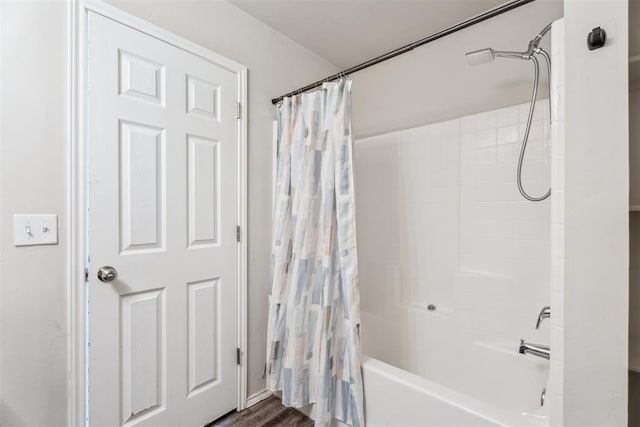 1016 N Deer Court Way, Mustang, OK 73064 - bathroom featuring shower / bath combination with curtain and wood finished floors