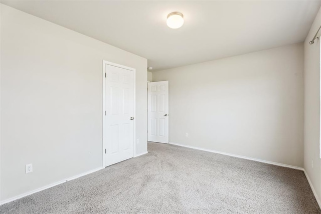 1016 N Deer Court Way, Mustang, OK 73064 - spare room with carpet and baseboards