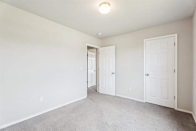 1016 N Deer Court Way, Mustang, OK 73064 - unfurnished bedroom with carpet and baseboards