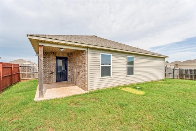 1016 N Deer Court Way, Mustang, OK 73064 - back of property with brick siding, a fenced backyard, and a patio area