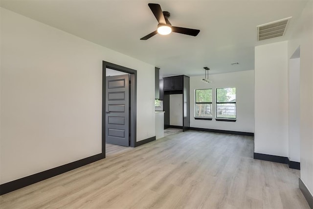 2325 SW Binkley St, Oklahoma City, OK 73119 - spare room with light wood-style flooring and a ceiling fan