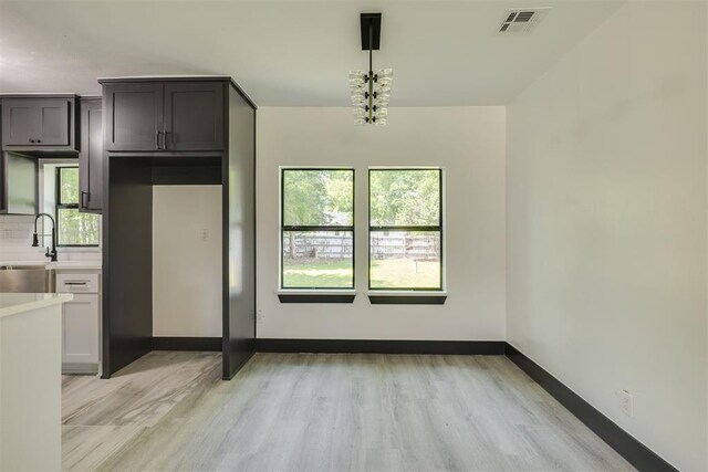 2325 SW Binkley St, Oklahoma City, OK 73119 - unfurnished dining area with light wood-style flooring and a sink