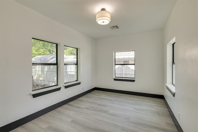 2325 SW Binkley St, Oklahoma City, OK 73119 - empty room with light wood-style floors and baseboards